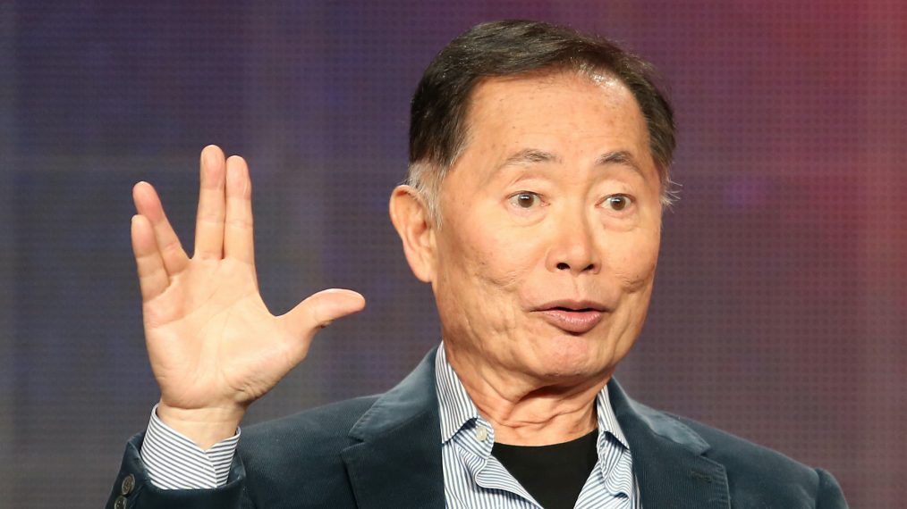 George Takei giving the Vulcan hand sign