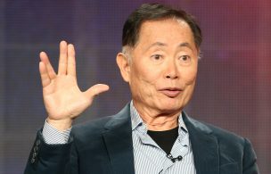 George Takei giving the Vulcan hand sign