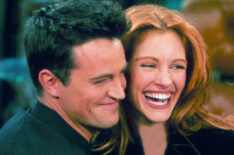 Matthew Perry and actress Julia Roberts hug each other on the set of Friends