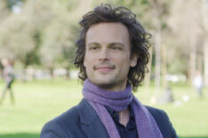 Matthew Gray Gubler on Criminal Minds sitting on a bench with purple scarf