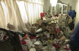 Debra's living room hoard gets a cleanup in Season 6, Episode 1.