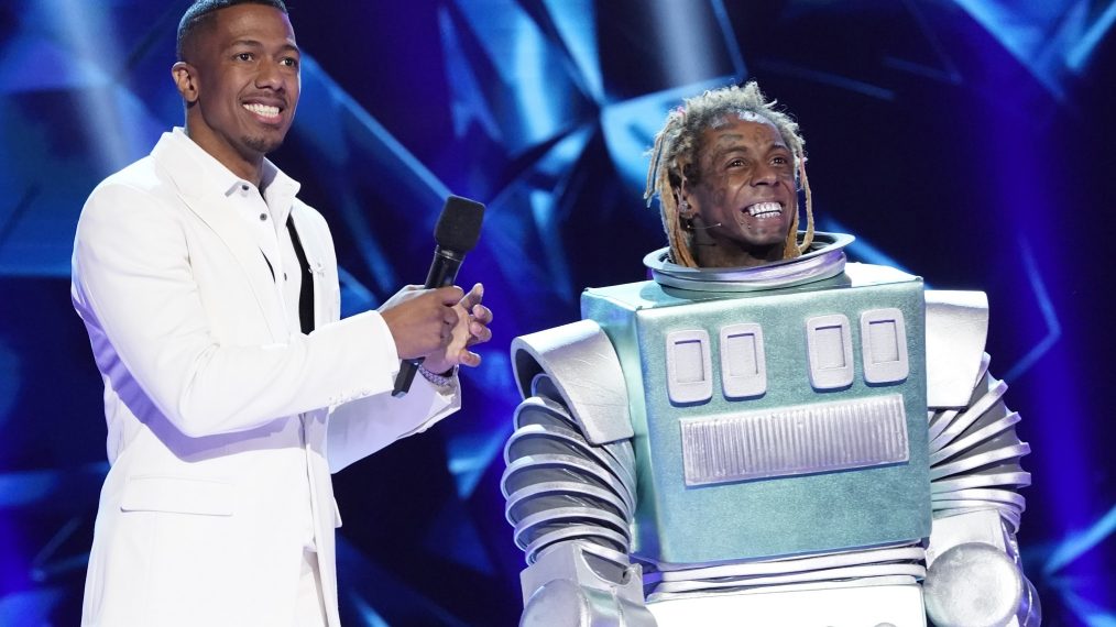 Host Nick Cannon and Lil Wayne in the Season Three premiere of The Masked Singer