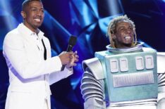 Host Nick Cannon and Lil Wayne in the Season Three premiere of The Masked Singer