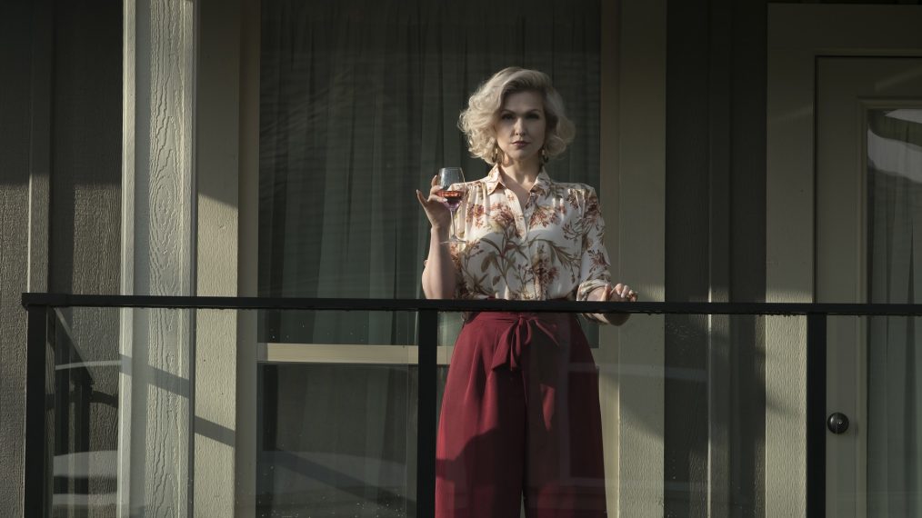 Jenn Lyon on a balcony in The Neighbor in the Window