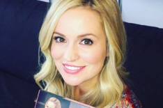 Emily Maynard of The Bachelorette holds up her book