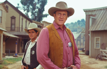 James Arness (as U.S. Marshal Matt Dillon) and Buck Taylor (as Newly O'Brien) from the television series 'Gunsmoke'