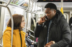 Violett Beane as Cara Bloom and Brandon Micheal Hall as Miles Finer on the subway in God Friended Me