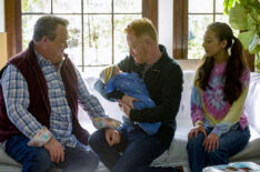 Eric Stonestreet, Jesse Tyler Ferguson, and Aubrey Emmons in 'Modern Family'