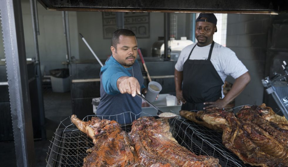 COOKING CHANNEL MAN FIRE FOOD ROGER MOOKING BASTING WHOLE HOG