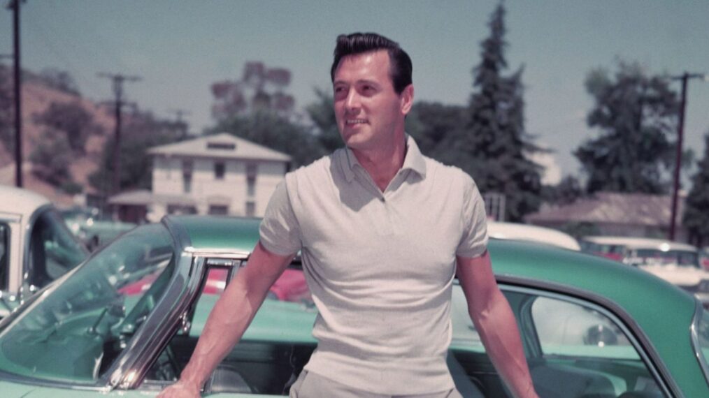 Rock Hudson leaning on car