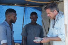 Don Wildman talking with Hatian fishermen about vodou and zombification