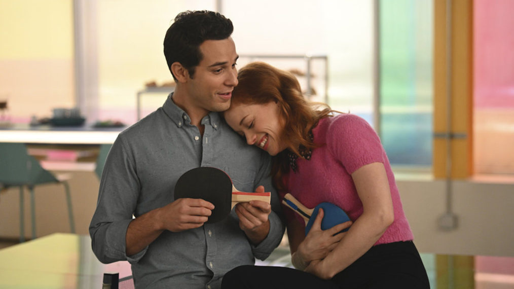 Skylar Astin as Max, Jane Levy as Zoey Clarke holding ping-pong paddles in in Zoey's Extraordinary Playlist - Season 1