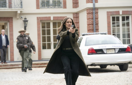 The Blacklist - Megan Boone holding a gun in Season 7
