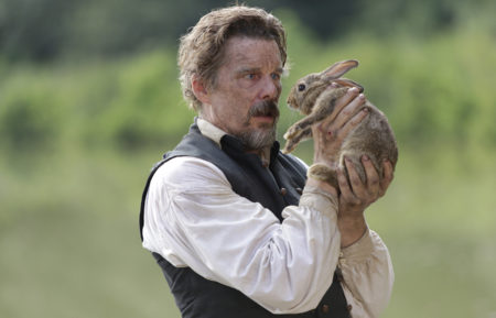 The Good Lord Bird - Ethan Hawke as abolitionist John Brown holding up a rabbit