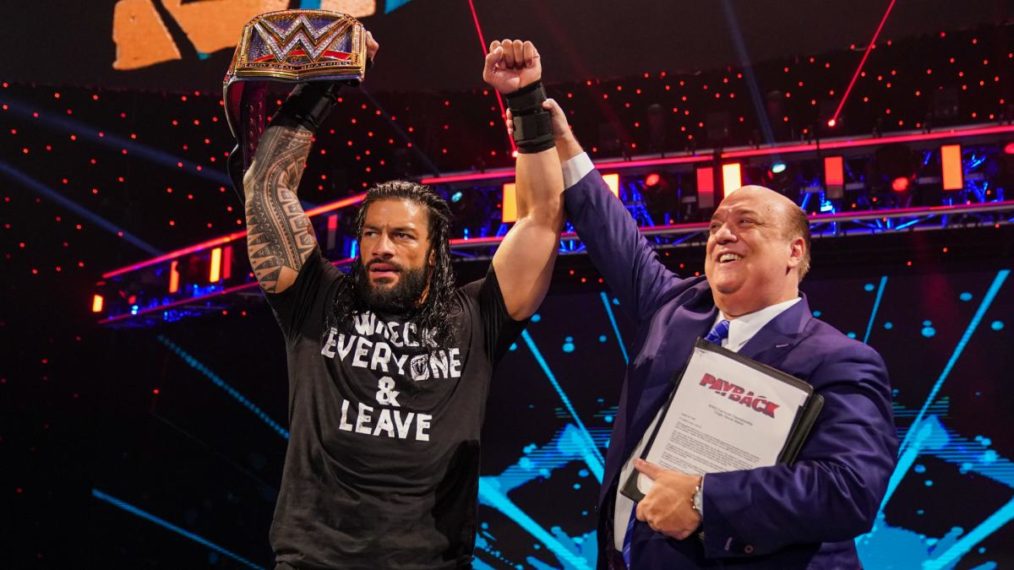 Paul Heyman celebrating with Roman Reigns