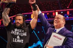 Paul Heyman celebrating with Roman Reigns