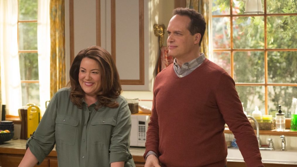 Greg and Katie stand in their kitchen in a promotional photo for American Housewife