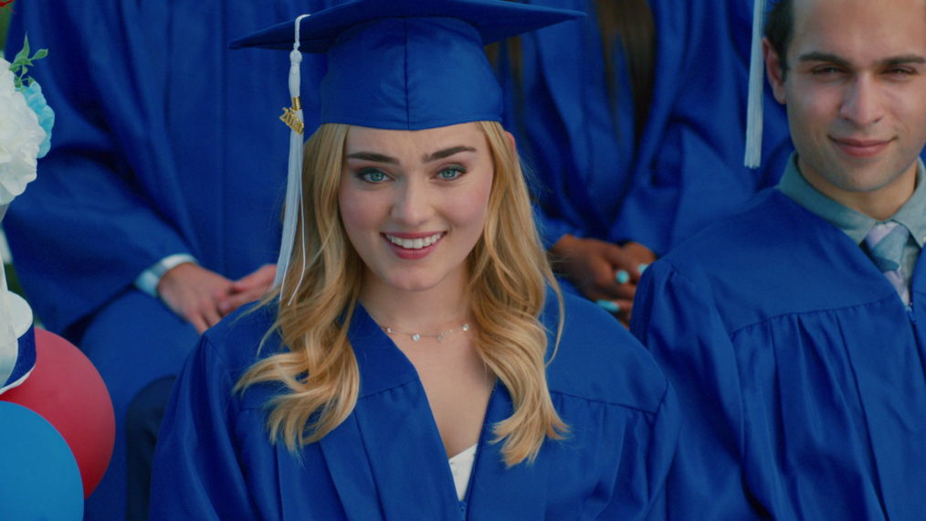 Taylor (Meg Donnelly) sits in a blue graduation gown