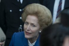 Margaret Thatcher (Gillian Anderson) takes questions from reporters