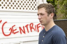 Jeremy Allen White as Lip Gallagher in Season 11 with the house painted Go Home Gentrifier