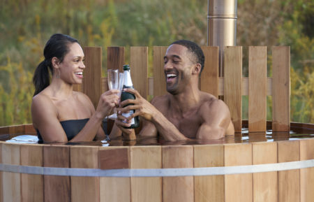 The Bachelor - Michelle Young and Matt James toasting in a hot tub