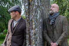 Men in Kilts - Sam Heughan and Graham McTavish lean on a tree