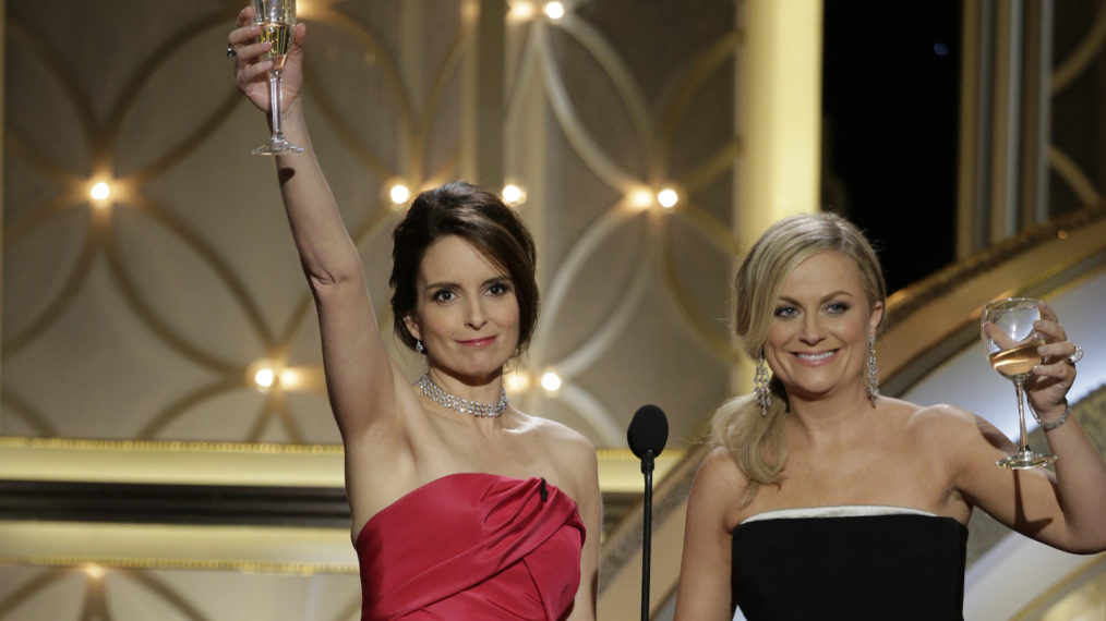 Tina Fey and Amy Poehler speak onstage during the 71st Annual Golden Globe Award