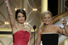 Tina Fey and Amy Poehler speak onstage during the 71st Annual Golden Globe Award