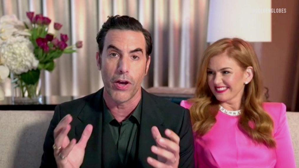 Sacha Baron Cohen (with Isla Fisher) accepts the Best Picture – Musical/Comedy award for ‘Borat Subsequent Moviefilm’ during the 78th Annual Golden Globe Awards