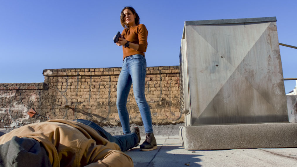 Daniela Ruah as Kensi Blye points a gun in NCIS Los Angeles - Season 12 Episode 15 - 'Imposter Syndrome'