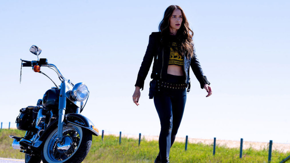 Melanie Scrofano with a motorcycle in the series finale of Wynonna Earp