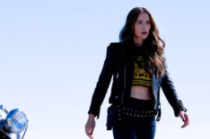 Melanie Scrofano with a motorcycle in the series finale of Wynonna Earp