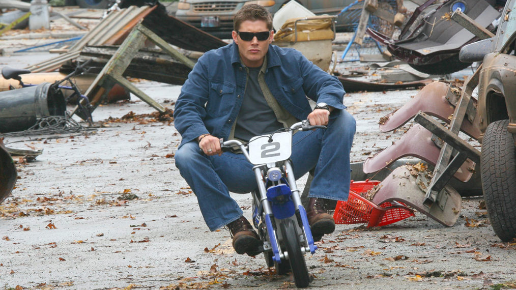 Jensen Ackles riding a mini bike