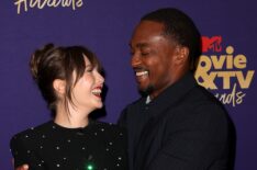 Elizabeth Olsen and Anthony Mackie pose backstage during the 2021 MTV Movie & TV Awards