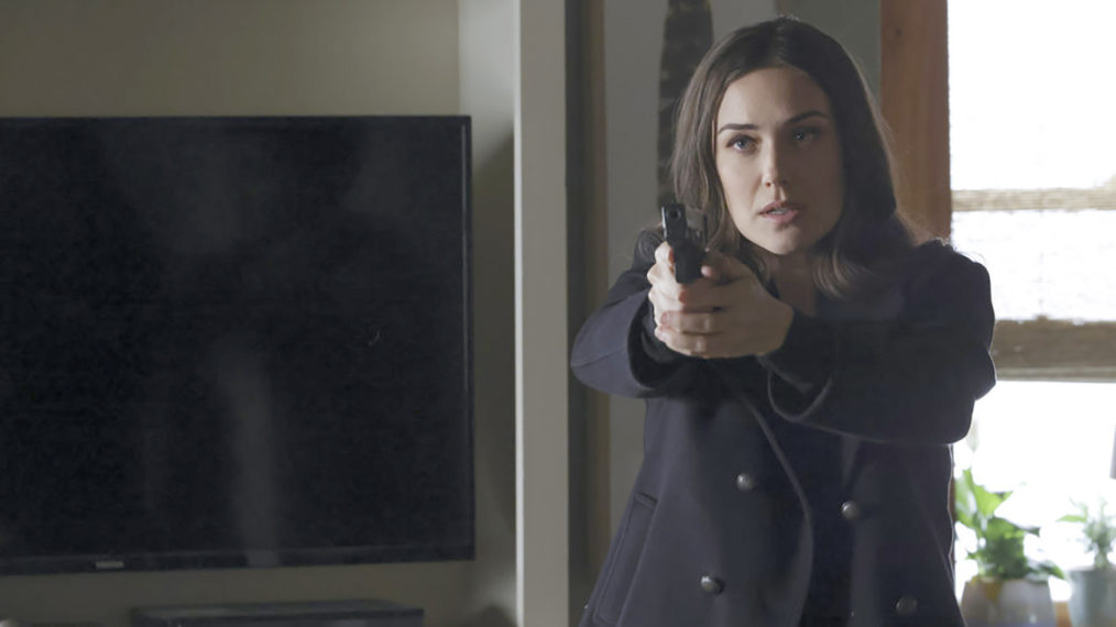 The Blacklist - Megan Boone holding a gun in Season 8