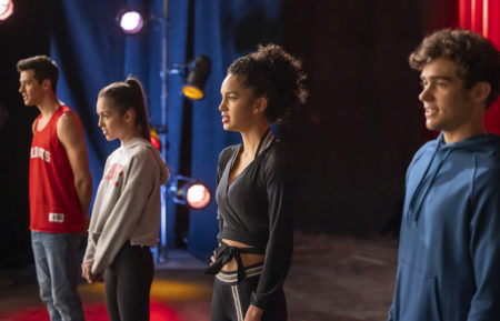 Matt Cornett, Olivia Rodrigo, Sofia Wylie, Joshua Bassett standing next to each other singing in High School Musical: The Musical: The Series - Season 3