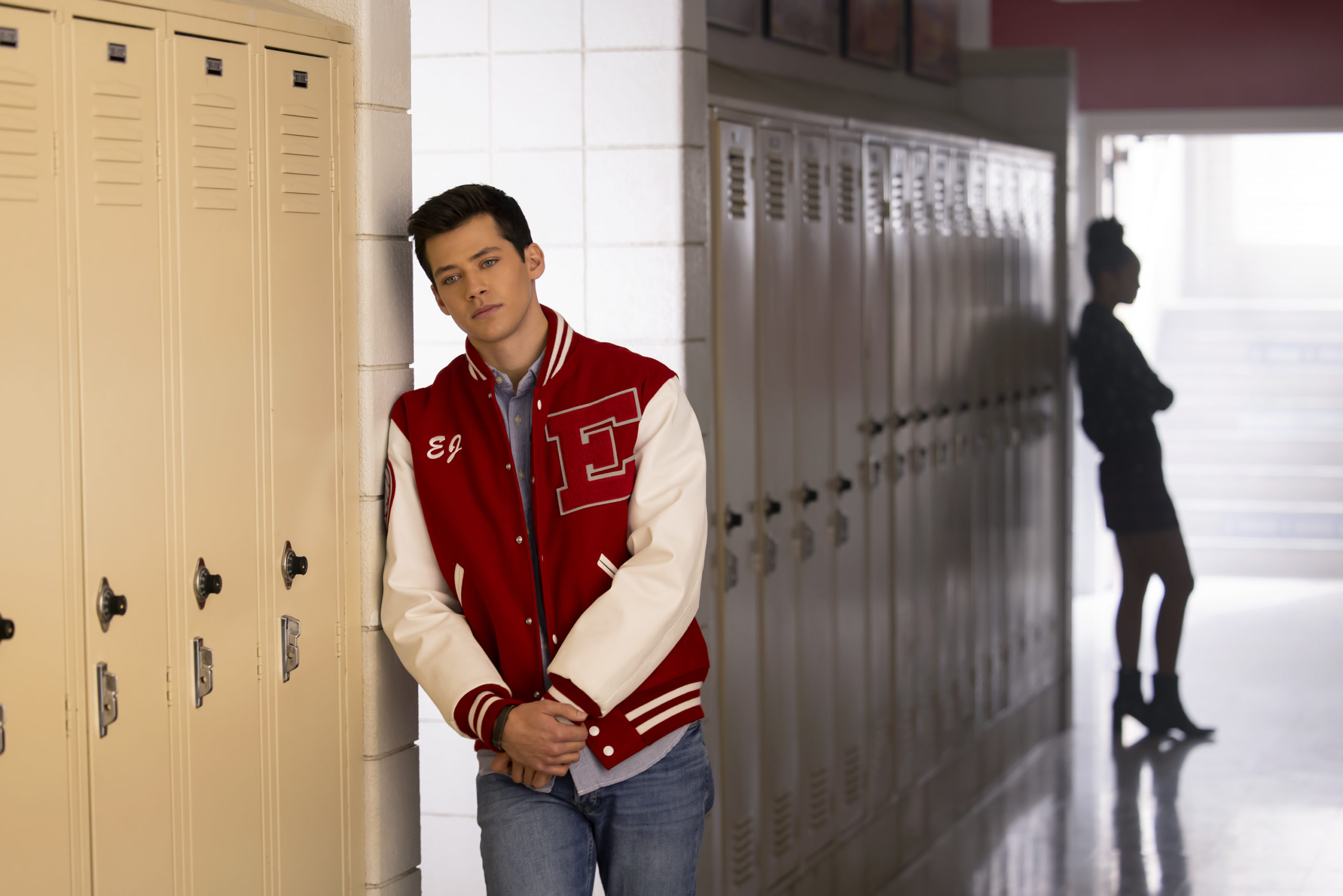 season two episode twelve EJ leaning against a locker with gina outline in the background