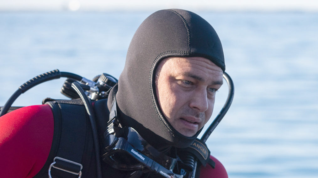 Taylor Kinney as Severide scuba diving in Chicago Fire