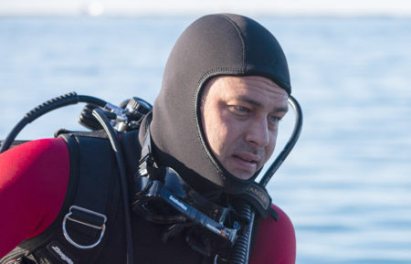 Taylor Kinney as Severide scuba diving in Chicago Fire