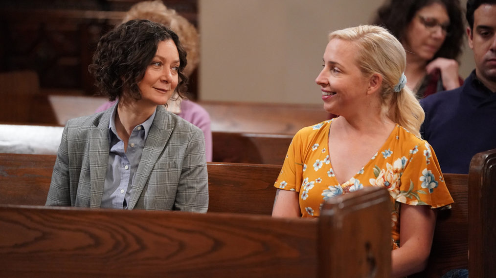 The Conners - Sara Gilbert and Lecy Goranson sitting in a church pew