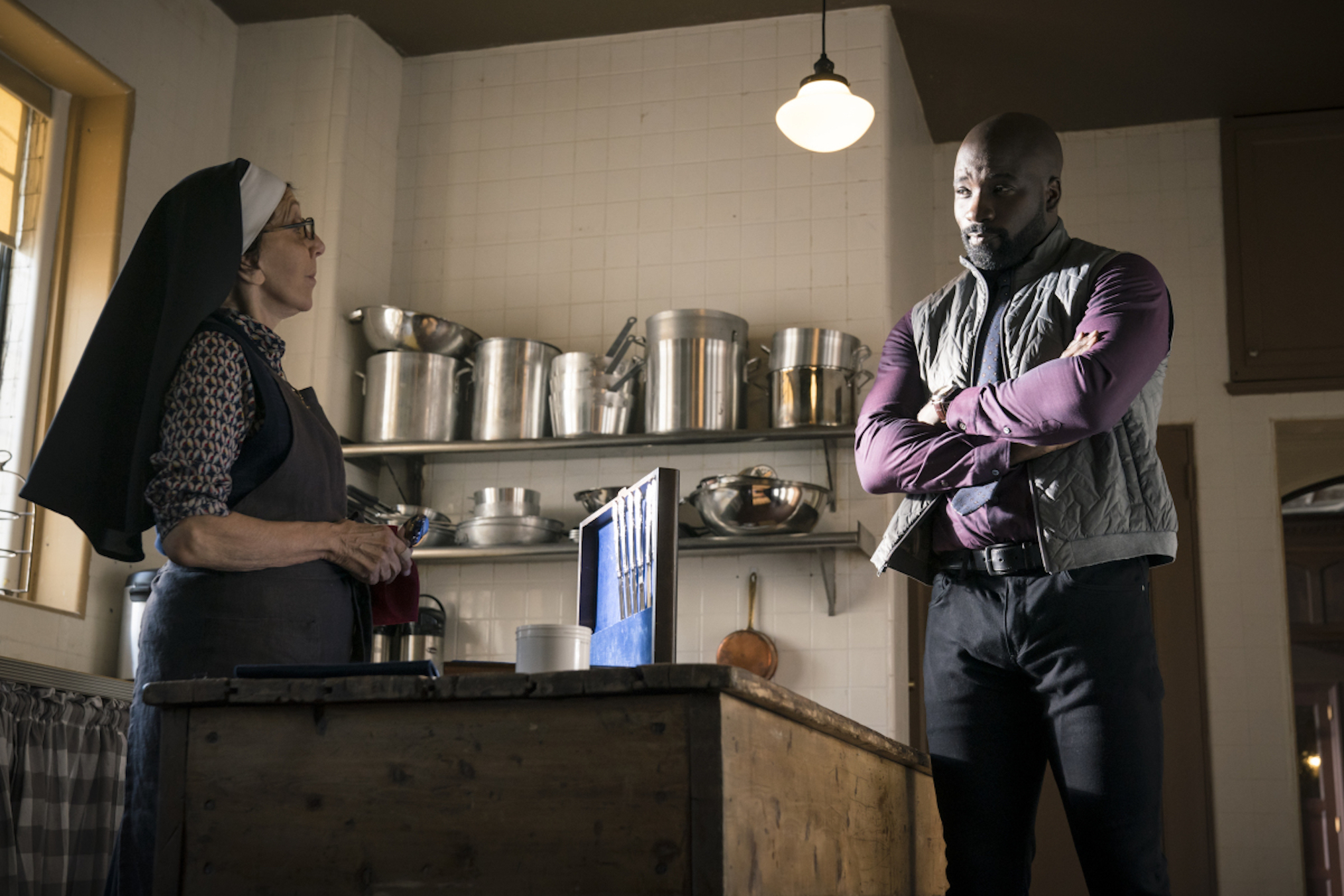 Andrea Martin as Sister Andrea, Mike Colter as David in Evil