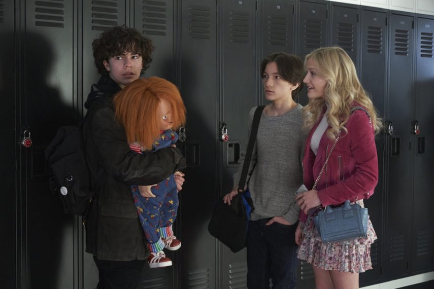 CHUCKY -- "Death by Misadventure" Episode 101 -- Pictured: (l-r) Zackary Arthur as Jake Wheeler, Chucky, Teo Briones as Junior Wheeler, Alyvia Alyn Lind as Lexy Cross -- (