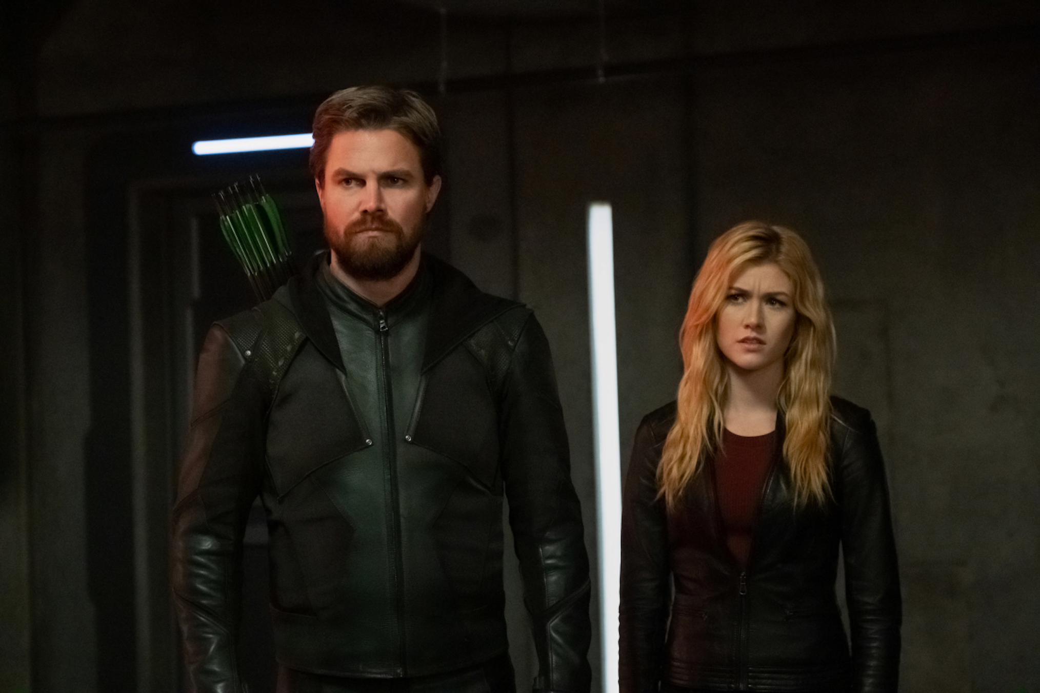 Stephen Amell as Oliver Queen/Green Arrow and Katherine McNamara as Mia in Supergirl