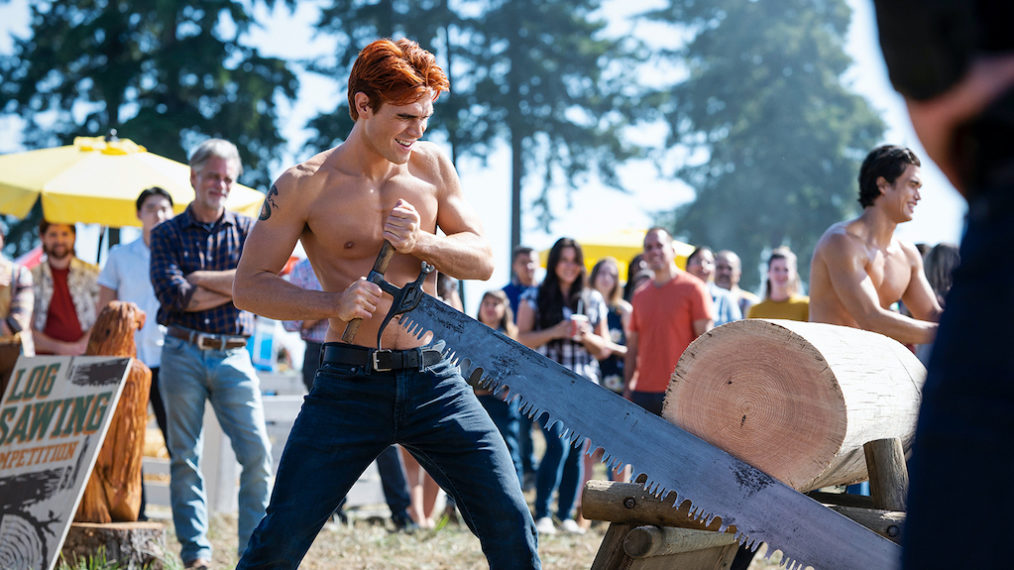 KJ Apa cutting wood on Riverdale - Season 6 premiere