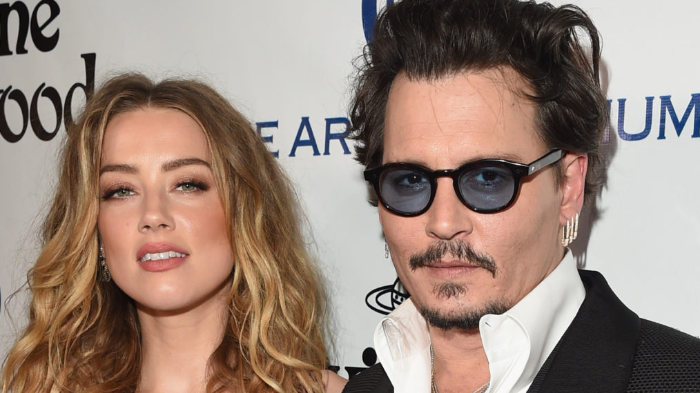 Amber Heard and Johnny Depp attend The Art of Elysium