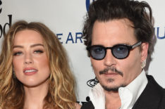 Amber Heard and Johnny Depp attend The Art of Elysium