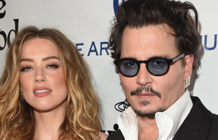 Amber Heard and Johnny Depp attend The Art of Elysium