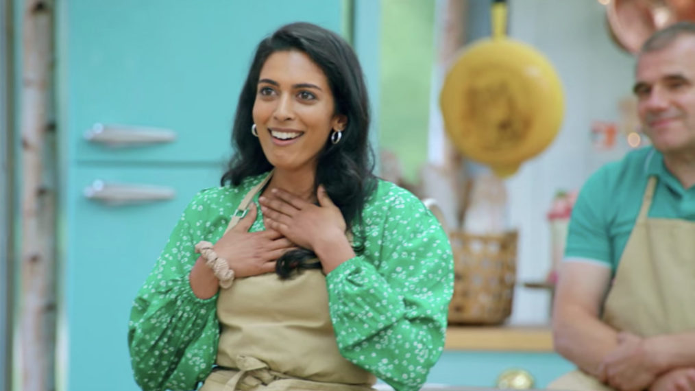 Contestant Crystelle is ecstatic after receiving a handshak from judge Paul Hollywood on The Great British Baking Show