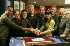 The NCIS team celebrates their milestone 150th episode with a cake-cutting ceremony. Series regulars Rocky Carroll, David McCallum, Cote de Pablo, Mark Harmon, Sean Murray, Pauley Perrette, Michael Weatherly and special guest star Robert Wagner