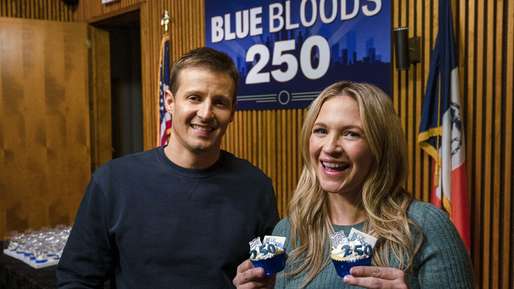 Will Estes and Vanessa Ray on Blue Bloods set with cupcakes